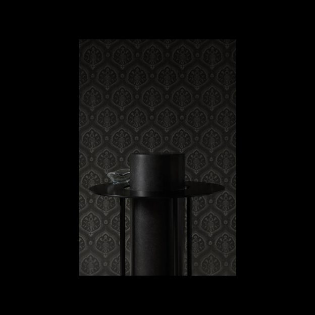 Artefact No 2 – Side table combining the materials of black steel and diabase.
