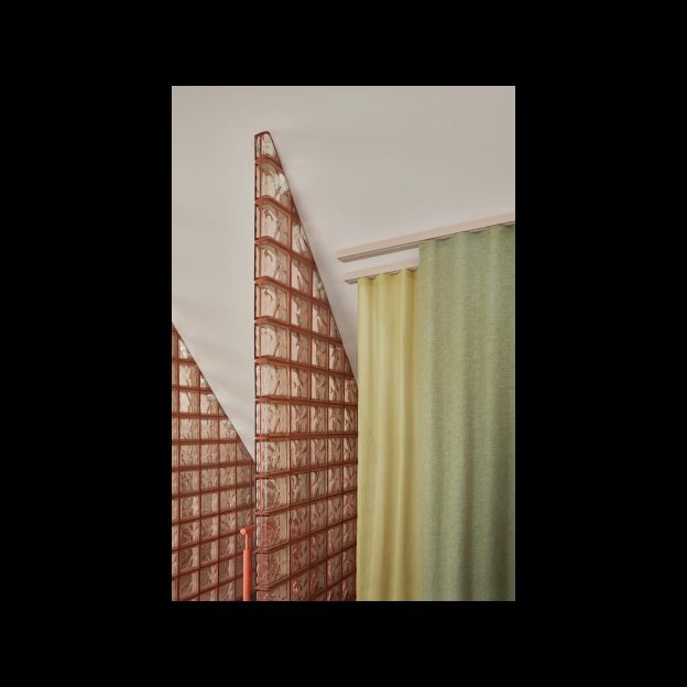 We let the light filter through the gateway of glas blocks to soften the line between spaces at the master bedroom of Salongsgatan.
