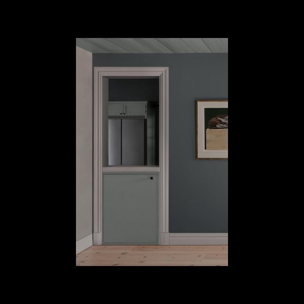 In the kitchen at Säflacka, the old door towards the living room was saved, to become a visual link between the two rooms, meanwhile giving the opportunity for storage in an otherwise lost space.Photo: Mathilda Werngren
