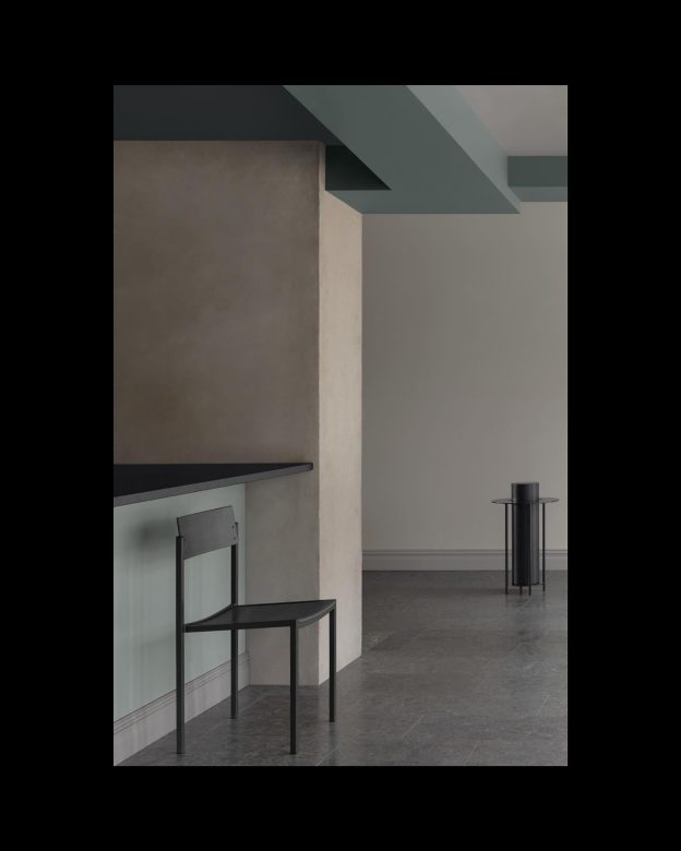 The meeting point at Säflacka Gård, where cooking meets dining meets living. A strict architecture soften by materials and nuances.Artefacts No 2 spotted in the back.Photo: Mathilda Werngren